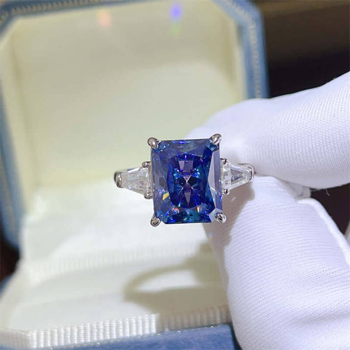 Blue Moissanite Ring 5 Carat Sapphire set in 925 sterling silver displayed in a jewelry box.