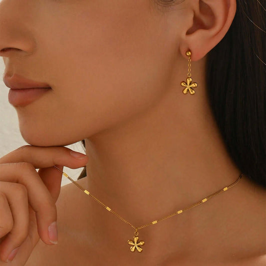 Gold Flower Necklace Set worn by a model, showcasing 18K gold plated earrings and necklace from DTP Jewellery.