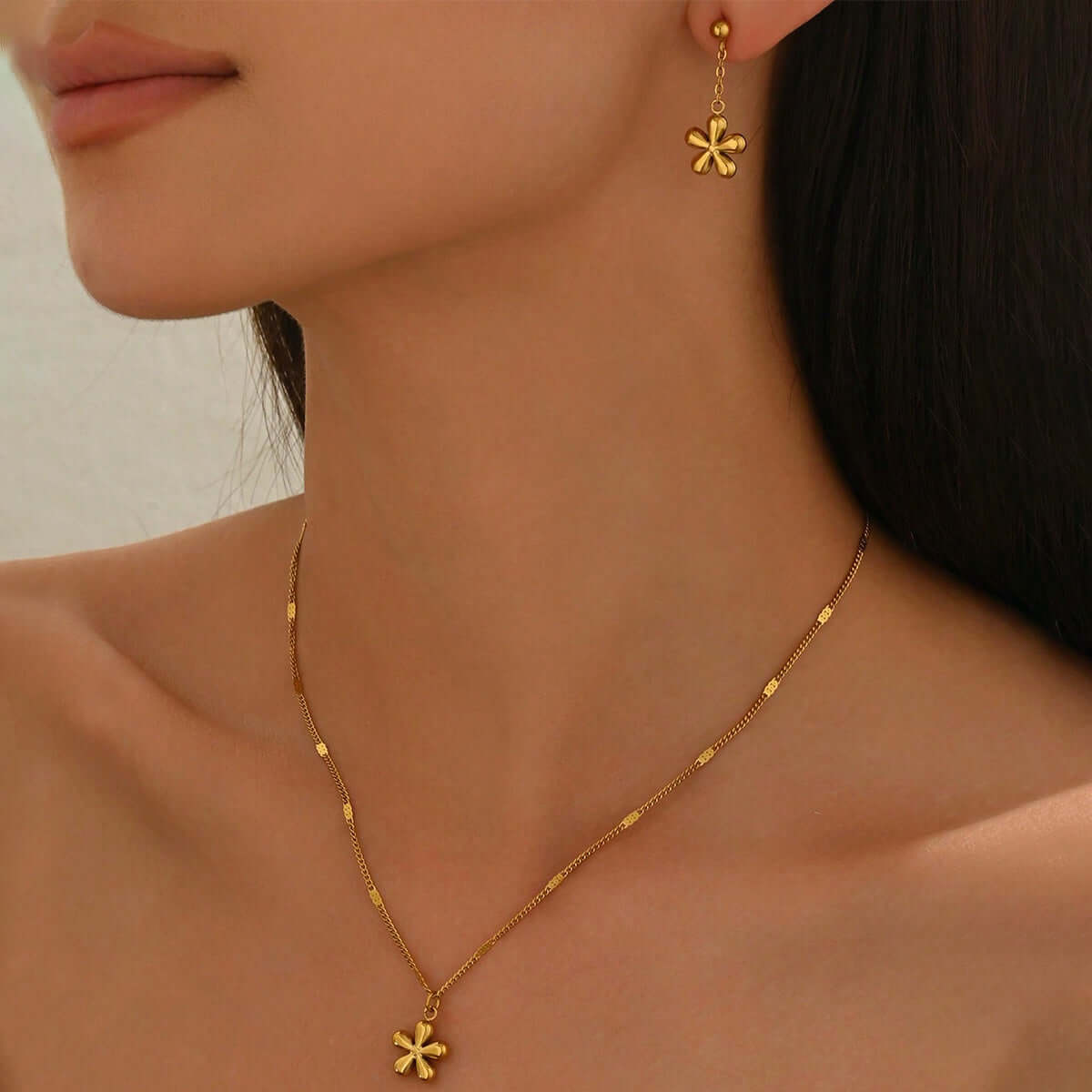 Gold Flower Necklace Set worn by a model, showcasing the delicate floral design and elegance of DTP Jewellery.